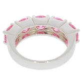 Round pink sapphire sterling silver ring with multiple gemstones showcasing elegance and luxury.